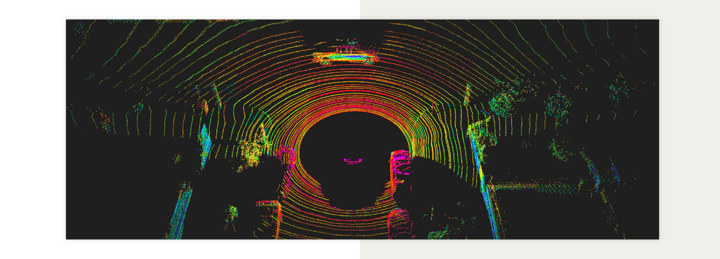 A man is standing in a tunnel with a lidar sensor, learning about how it works in autonomous cars.