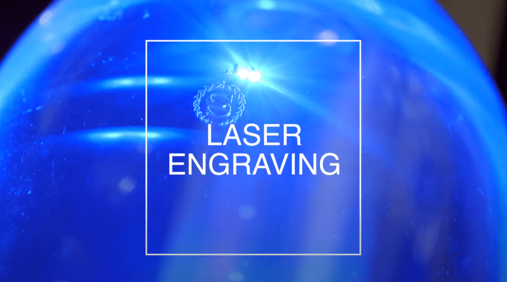 A blue object with laser engraving.