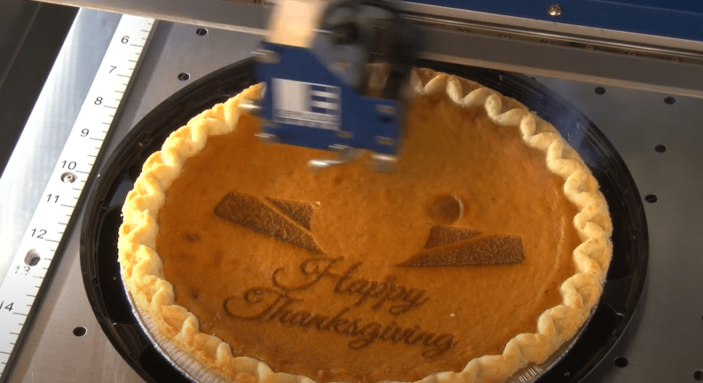 A Thanksgiving pie laser engraved with a happy message.
