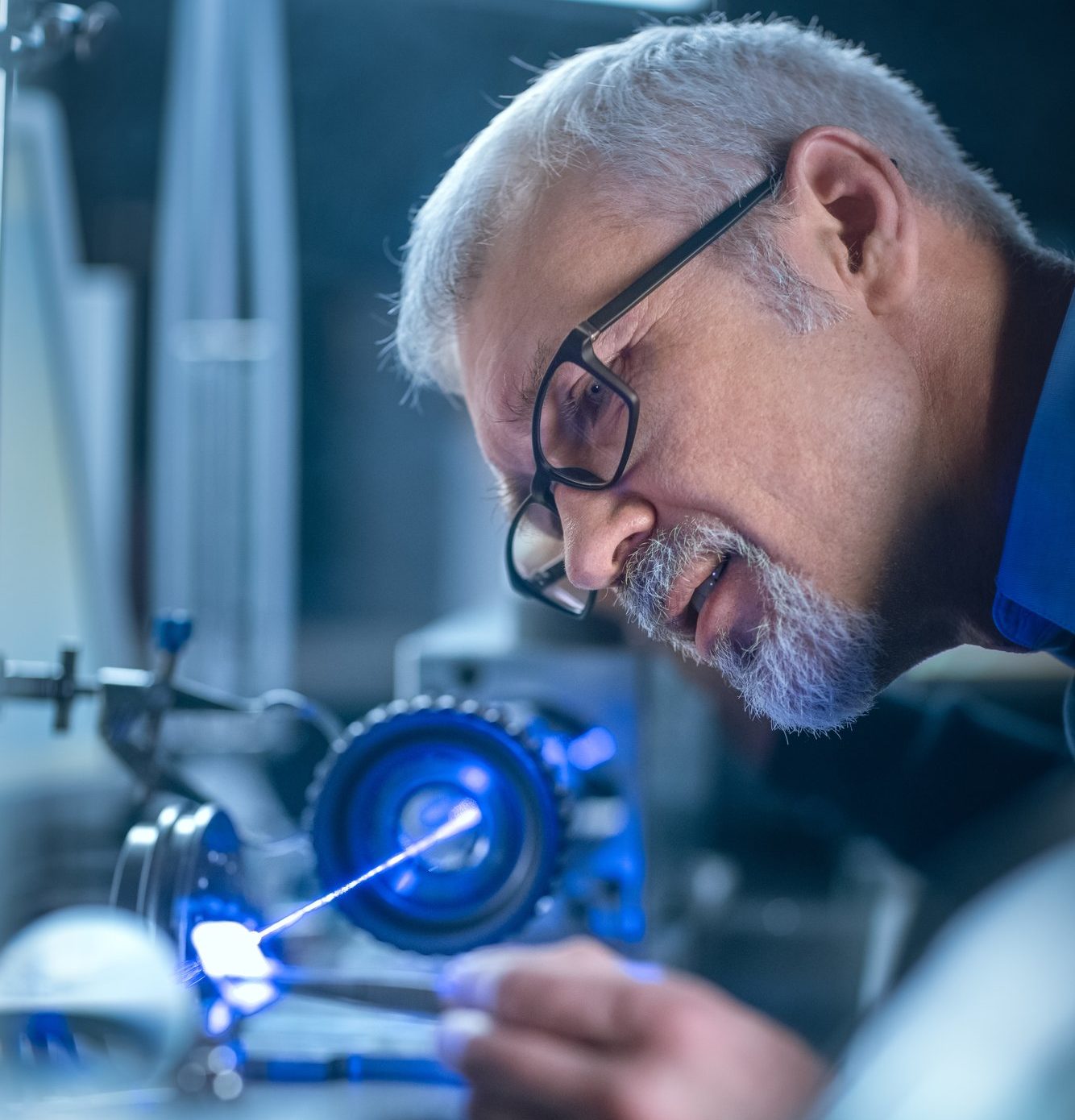 a man working on a machine in a factory.