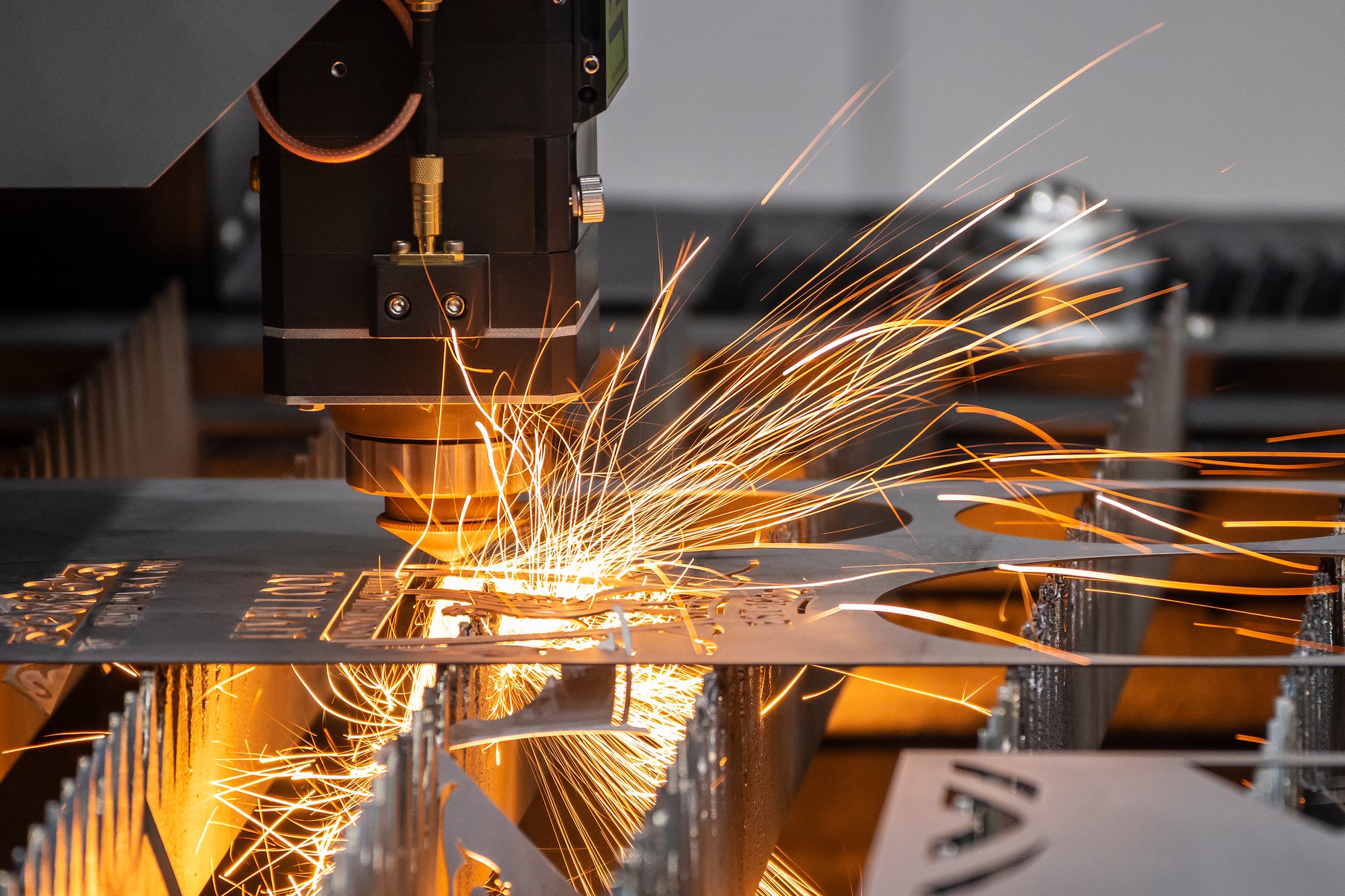 a piece of metal being worked on by a machine.