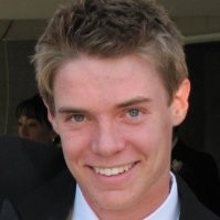 a close up of a person wearing a suit and tie.
